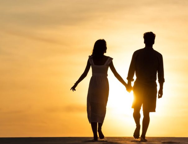 stock-photo-silhouettes-man-woman-holding-hands